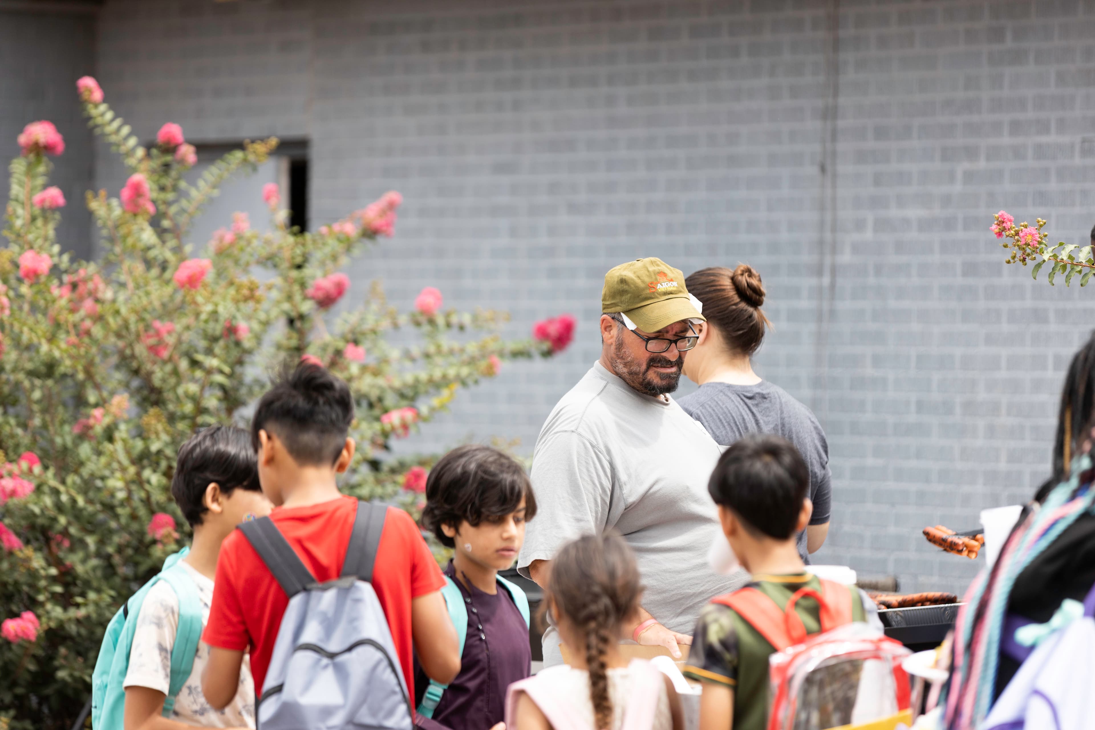 Students with backpacks gathered at a City Center Back 2 School community event